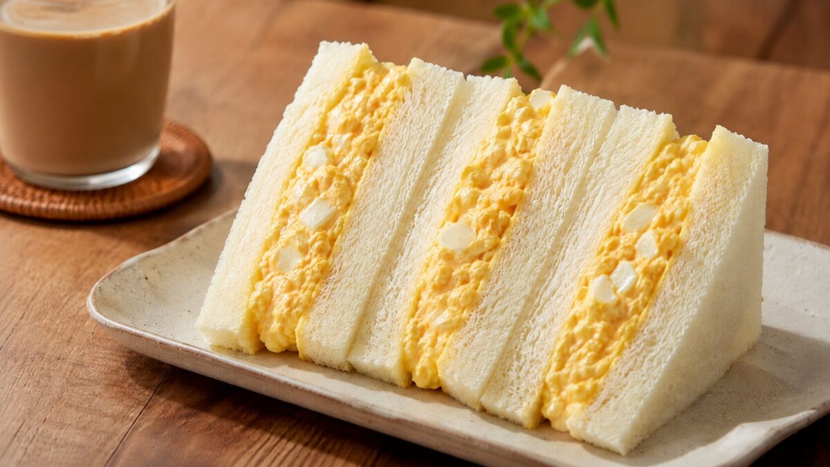 Japanese egg sandwich served on a plate with coffee