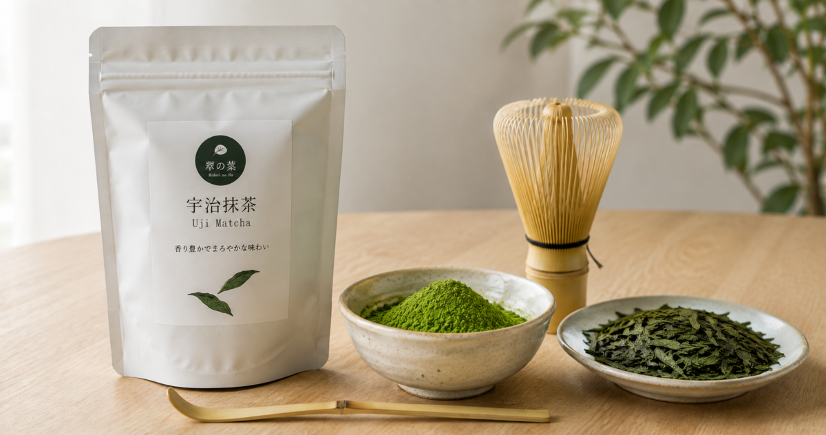 Fine Japanese matcha powder beside tencha leaves and traditional tea utensils on a clean wooden table